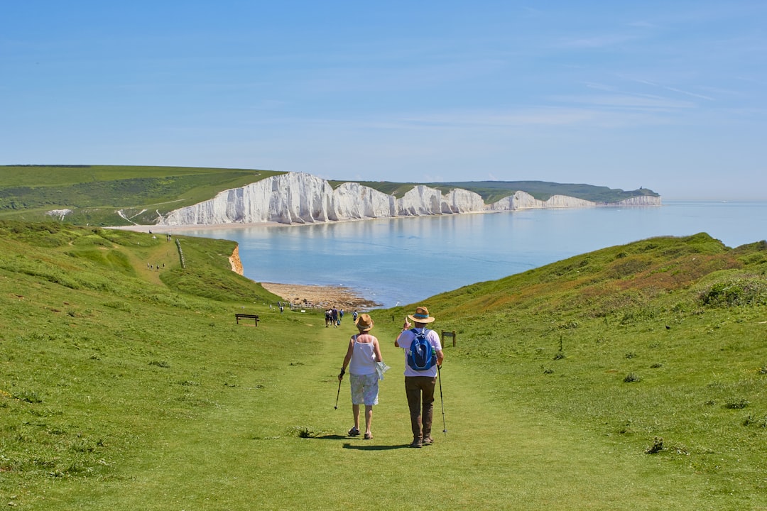An old couple walking towards the Seven Sisters